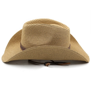 Detail of hand-woven straw cowboy hat with embossed band and adjustable windproof cord