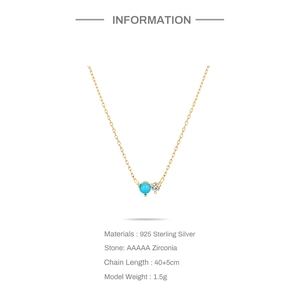 Macro detail of S925 sterling silver chain with turquoise moon pendant and zirconia stone