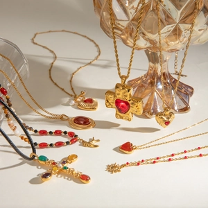 Gold vintage stainless steel pendant necklaces with red agate and cross charms on white