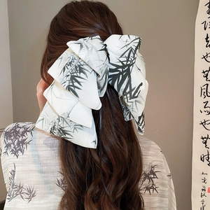 Detail of silk satin ribbon hair clip with traditional Chinese ink bamboo pattern