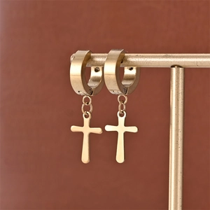 Macro shot of 18K gold plated stainless steel cross drop earrings on display stand