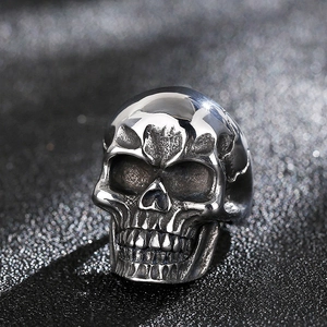 Macro detail of gothic skull ring with vintage polished finish on black fabric