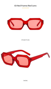 Detail view showing front and side of vintage rectangular red frames sunglasses