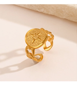 Macro detail of gold-plated octagram ring with rock texture and hollow chain band