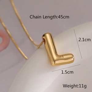 Macro shot of gold balloon letter L pendant with dimensions 2.1x1.5cm and 45cm chain