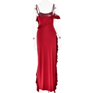 Close-up of red spaghetti strap maxi dress featuring elegant ruffle details and side slit