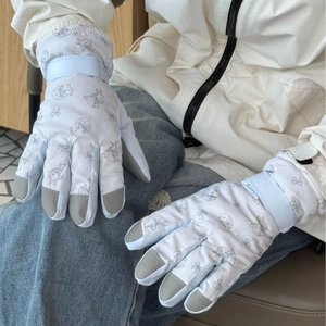 White cartoon rabbit ski gloves with blue bow prints and adjustable wrist straps