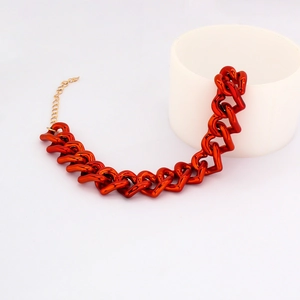Detail of red heart chain pet necklace with adjustable gold-tone extender chain link
