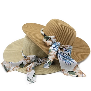 Bohemian wide brim straw hats with floral ribbons and pearl beads for summer sun protection