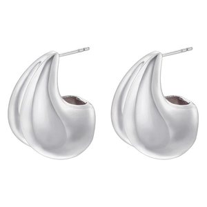 Macro detail of silver geometric water drop earrings with a polished mirror finish