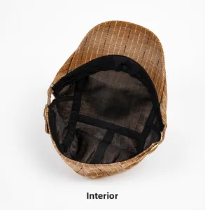 Internal view of brown striped flat cap showing black lining and sweatband detail