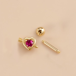 Golden heart arrow stud earring with red zircon gemstone and screw back ball closure