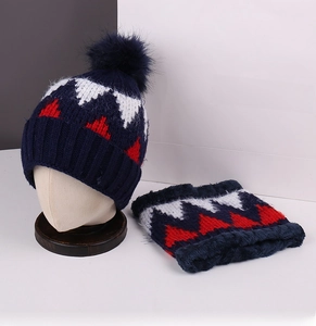 Detailed knit texture of navy blue winter hat and scarf set with fleece lining