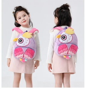 Detail view of purple plush owl backpack showing soft 3D owl features and shoulder straps