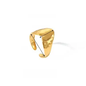 Macro view of gold irregular wavy ring showing dimensions 1.23cm by 1.76cm