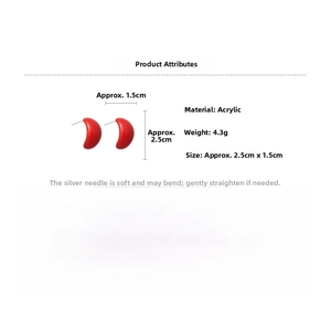 Detail view of red crescent acrylic earrings with dimensions 2.5cm by 1.5cm and silver pins