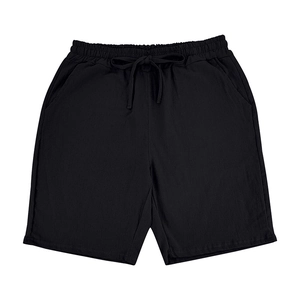 Detail of black linen drawstring shorts featuring elastic waistband and side pockets