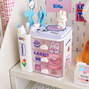 Close-up of cloud-style desk organizer with three transparent drawers and side pen holder