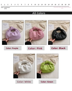 Detail showing various colors of pleated cloud bags with minimalist knotted handles