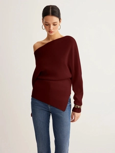 Detail of burgundy ribbed knit sweater featuring off-shoulder neck and irregular hemline