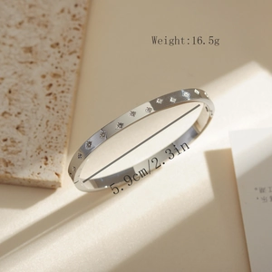 Detail view of silver stainless steel engraved star bracelet with inner diameter 5.9cm