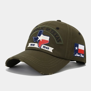 Detail of army green baseball cap featuring Texas 1836 embroidery and vintage distressed brim