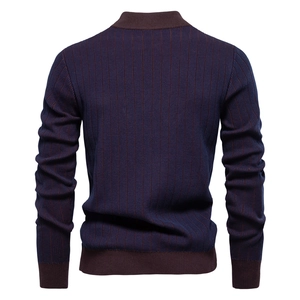 Detail of slim fit men's striped knit sweater showing vertical texture and brown ribbed cuffs