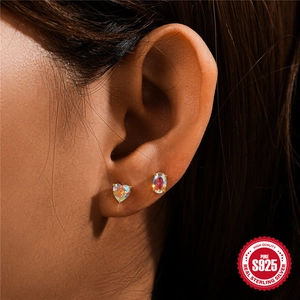 Elegant S925 sterling silver moonstone stud earrings with gold plating on model