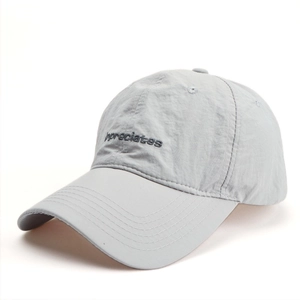 Detail of light gray quick-dry baseball cap featuring high-quality letter embroidery