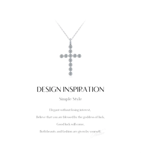 Detail of S925 silver cross necklace with VVS1 moissanite stone and design inspiration text