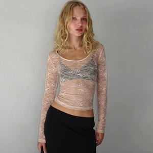 Haut sexy en dentelle florale transparente, manches longues et coupe ajustée abricot