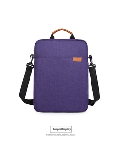 Detail view of purple Oxford cloth laptop bag with leather handles and detachable strap