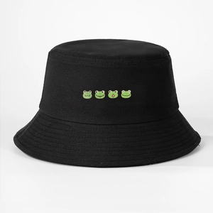 Detailed close-up of four cute cartoon frog embroidery on black cotton fisherman bucket hat