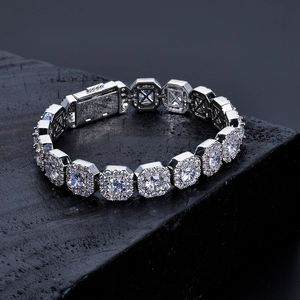Macro shot of silver tennis bracelet with square links and pavé set cubic zirconia