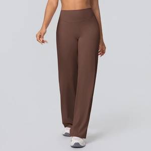 Detail of high-waisted seamless waistband on dark brown wide-leg yoga pants
