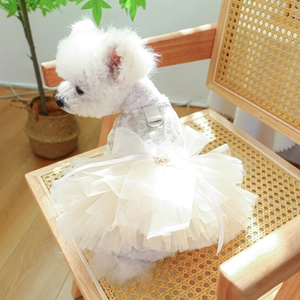 Detail of floral lace embroidery and mesh bow on an ivory pet wedding dress