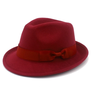 Detail shot of the wine red wool fedora hat with matching ribbon bow decoration