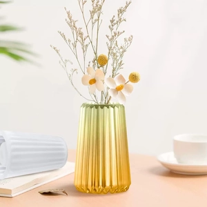 Modern gradient yellow glass vase with vertical striped texture for home decor