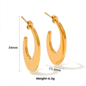 Polished gold oval hoop earrings with size specifications 34mm by 17.3mm and 6.5g weight