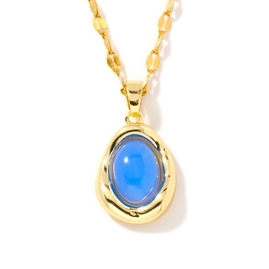 Elegant gold-tone necklace with a radiant blue oval pendant on a white background