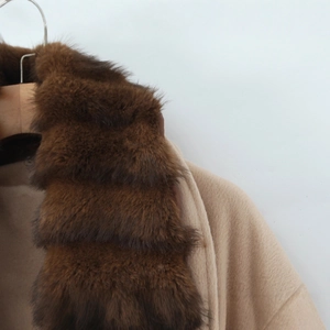 Women's beige wool coat with a luxurious dark brown faux fur collar and belted waist
