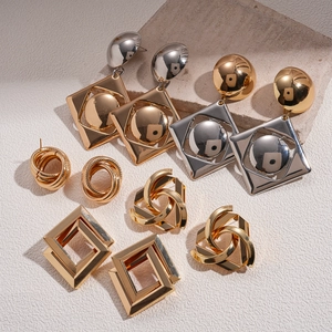 Minimalist geometric hollow earrings set in gold and silver finish on stones
