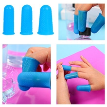 Blue silicone finger protectors with anti-slip texture shown in various usage scenarios