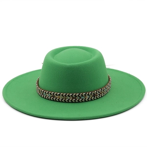 Detailed view of grass green wool felt flat top hat with ethnic woven band texture