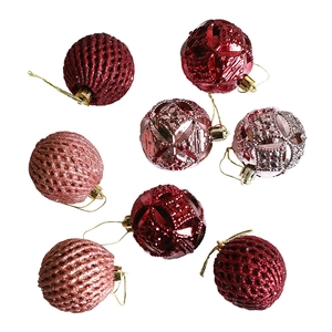 Set of 8 red and pink Christmas balls with hollow floral and grid textured designs