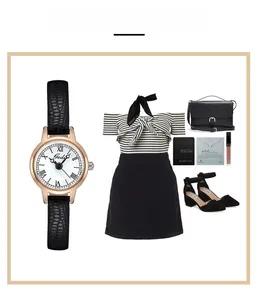 Detail of rose gold quartz watch with black leather strap and chic OOTD fashion styling