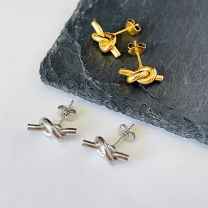 Minimalist knot stud earrings in gold and silver stainless steel finish set