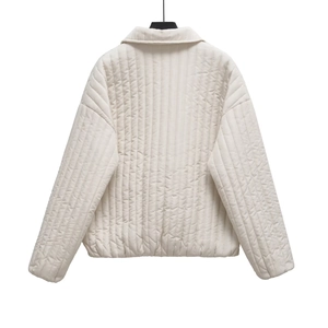 Back view of stylish off-white quilted jacket with lapel collar and long sleeves