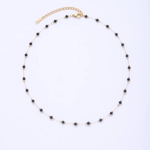 Detail of beaded necklace with gold chain and black round beads with lobster clasp