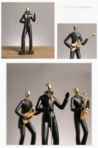 Figurines de musiciens abstraites noir et or avec détails de chanteurs et guitaristes